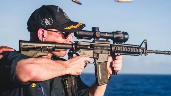 Navy-skipper-roasted-for-posing-with-rifle-with-scope-on-backward-CREDIT-US-NAVY
